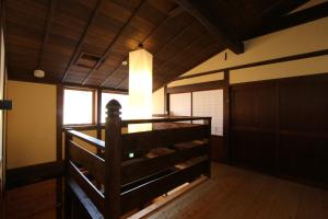 Postel nebo postele na pokoji v ubytování Iwamura Guest House Yanagiya