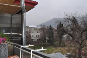 a balcony with a view of a building at Hotel Your Comfort in Tbilisi City