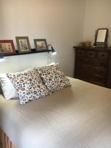 Postel nebo postele na pokoji v ubytování La casita de la ciudad