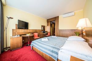 Voodi või voodid majutusasutuse Hotel Jana toas