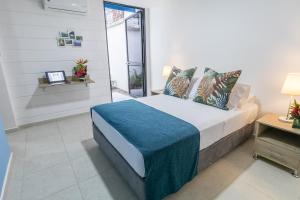 Postel nebo postele na pokoji v ubytování Hotel Casa Vallecaucana
