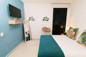 TV a/nebo společenská místnost v ubytování Hotel Casa Vallecaucana