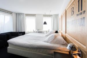 Postel nebo postele na pokoji v ubytování B's Strandappartementen