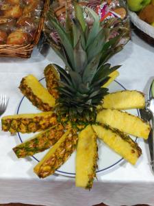 
bananas and other fruits on a table at El Foyu in Colunga
