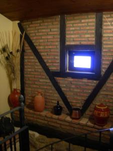 
a fire place in the corner of a room at La casa del Vado in Hervás
