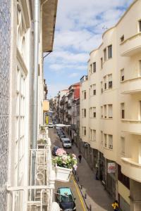 a view of a street from a balcony of a building at Almada Story Apartments by Porto City Hosts in Porto