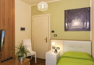 Televízia a/alebo spoločenská miestnosť v ubytovaní Hotel Il Giardino