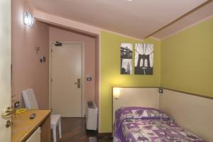 Posteľ alebo postele v izbe v ubytovaní Hotel Il Giardino