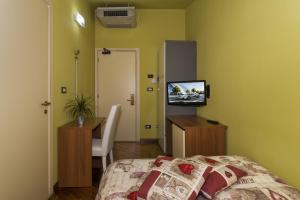 Posteľ alebo postele v izbe v ubytovaní Hotel Il Giardino