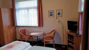 Un televizor și/sau centru de divertisment la Villa Martha