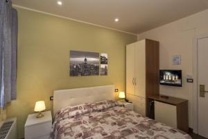 Posteľ alebo postele v izbe v ubytovaní Hotel Il Giardino