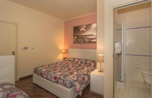 Posteľ alebo postele v izbe v ubytovaní Hotel Il Giardino