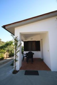 a view from the outside of a house with a patio at Il Capperino in Capoliveri