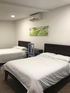 Postel nebo postele na pokoji v ubytování Hotel Plaza