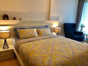 Postel nebo postele na pokoji v ubytování Astra Suites Central