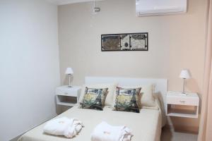Una cama o camas en una habitación de Complejo Amarelo