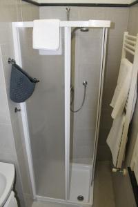 a shower with a glass door in a bathroom at "la Luna" in Vernazza