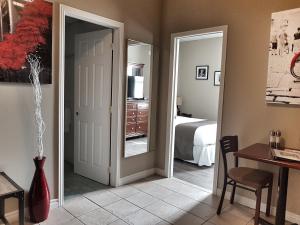 a room with a door leading to a bedroom at Cozy 1-Bedroom Suite #17 by Amazing Property Rentals in Gatineau