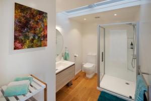 a bathroom with a shower and a toilet at Fairview Unit 1 in Palm Beach
