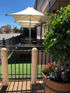 
a white umbrella sitting on top of a patio at Cornwall Hotel in Moonta
