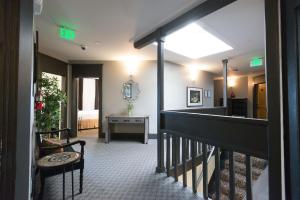 a hallway with a stairway with a room at Camas Boutique Hotel in Camas