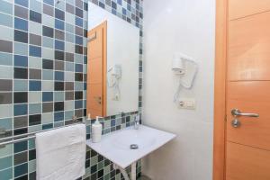 a bathroom with a sink and a mirror at BET Apartments - Tramontana Apartments in Valencia