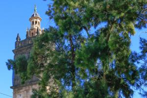 a tall tower with a tree in front of it at BET Apartments - Tramontana Apartments in Valencia