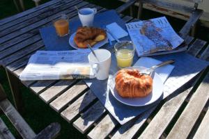 a picnic table with two plates of food and drinks at BET Apartments - Tramontana Apartments in Valencia