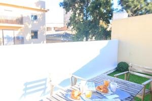 a table with plates of food on a balcony at BET Apartments - Tramontana Apartments in Valencia