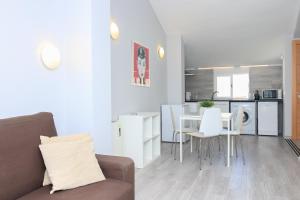 a living room with a couch and a table at BET Apartments - Tramontana Apartments in Valencia