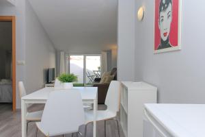 a white living room with a white table and chairs at BET Apartments - Tramontana Apartments in Valencia