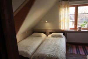Katil atau katil-katil dalam bilik di Tuulingu Guest House at Matsalu National Park