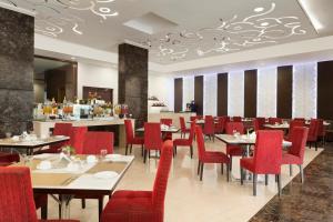 A restaurant or other place to eat at Ramada Jamshedpur Bistupur