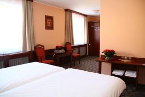 Postel nebo postele na pokoji v ubytování Hotel Baltaci U Náhonu + 29 fotografií