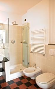 a bathroom with a shower and a toilet and a sink at Hotel Gianni Franzi in Vernazza
