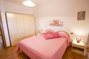 Posteľ alebo postele v izbe v ubytovaní Appartamenti il Sogno