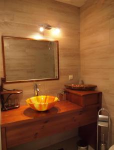 a bathroom with a sink and a mirror at Momini Dvori Boutique Guest House in Bansko
