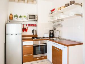 Kuchyň nebo kuchyňský kout v ubytování Apartments Villa Diha