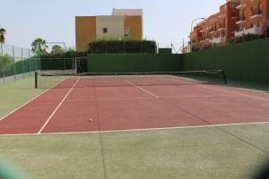 a tennis court with a tennis ball on it at Bungalow Torremata Ref 3778 in La Mata