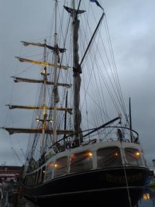 a large sail boat sitting in the water at Hôtel de la Gare in Saint Malo