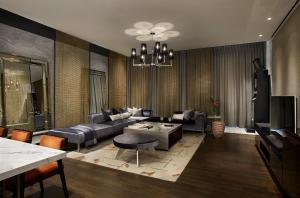 a living room with a couch and a table at L7 Gangnam in Seoul