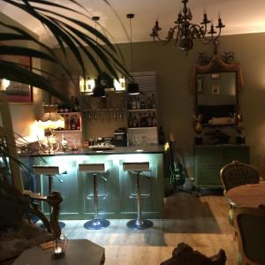 a kitchen with a green island in a room at The White House Hotel in Newquay
