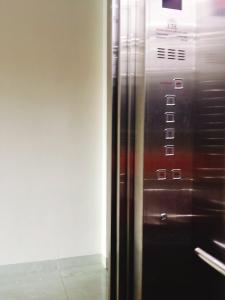 a close up of a elevator in a building at Hotel Tan Phu in Lagi +30 photos
