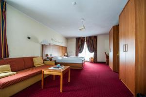 Postel nebo postele na pokoji v ubytování Hotel Touring