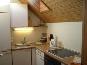 a kitchen with a sink and a counter top at Friesenhof Blank in Sulzberg