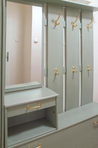 a bathroom with a mirror and a sink at Modern Apartment Krakovska in Prague
