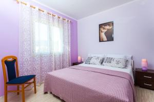 Postel nebo postele na pokoji v ubytování Gold & Silver Apartments