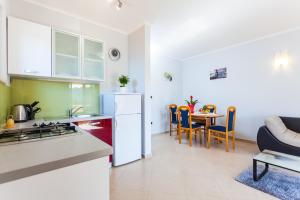 Kuchyň nebo kuchyňský kout v ubytování Gold & Silver Apartments