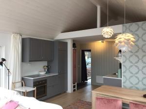 Postel nebo postele na pokoji v ubytování Steigen Lodge Sjøhytter + 35 fotografií