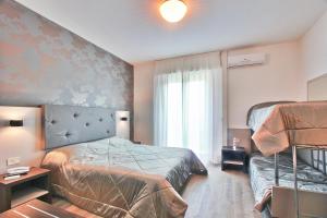 Postel nebo postele na pokoji v ubytování Hotel Gambrinus